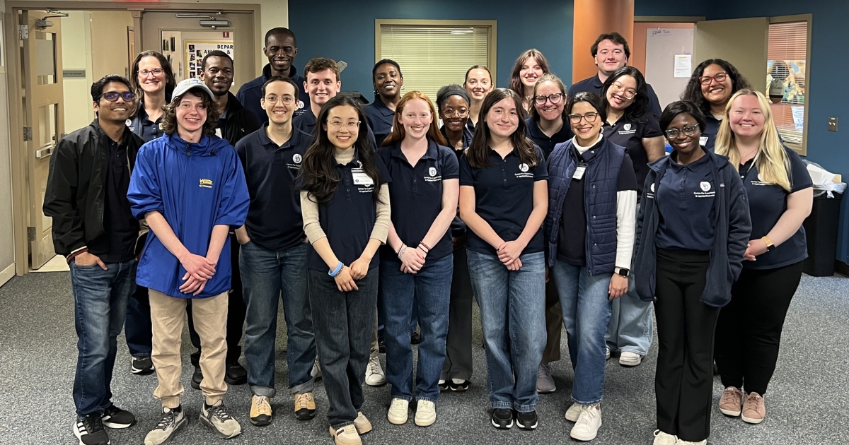 CEAE students and staff pose in the lab.
