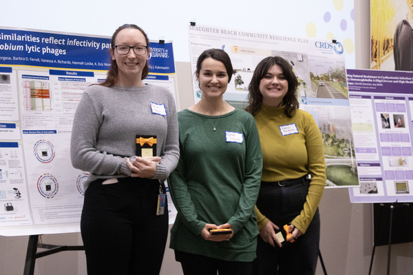 Rachel Keown, Kathryn Ellwood, and Ashleigh Montgomery stand in the Townsend Hall Commons.