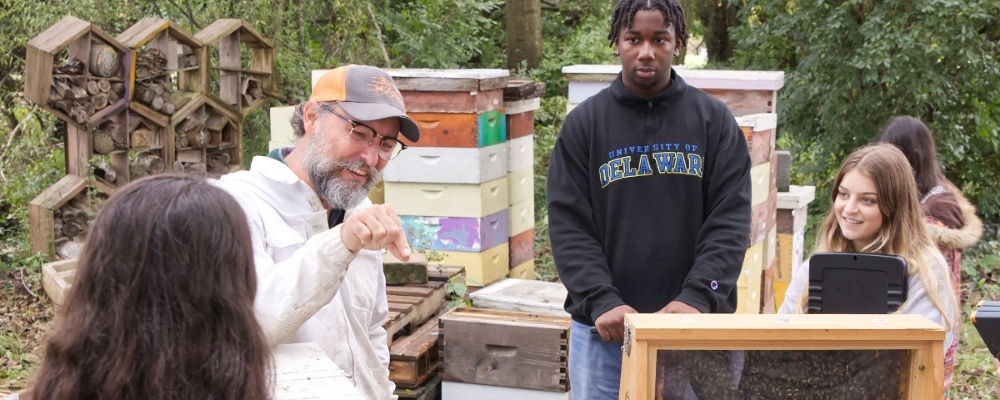 Students learning in the apiary.