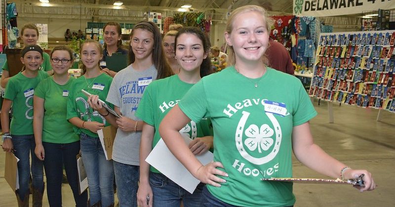 Teens in 4-H shirts pose at the Delaware State Fair.