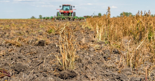 Farmer spraying herbicide in a field
