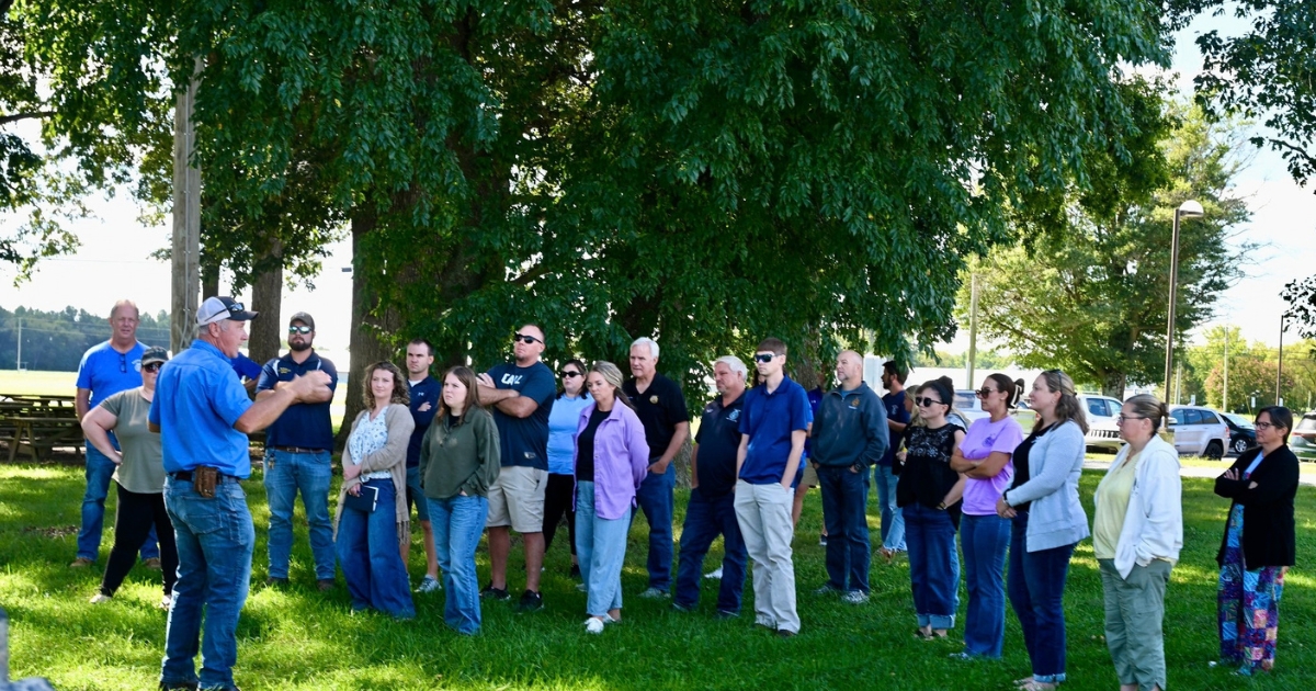 James Adkins, director of the Carvel Research Center explains to the visiting teachers how precision agriculture technology is used on the equipment used on the 347-acre research farm. 