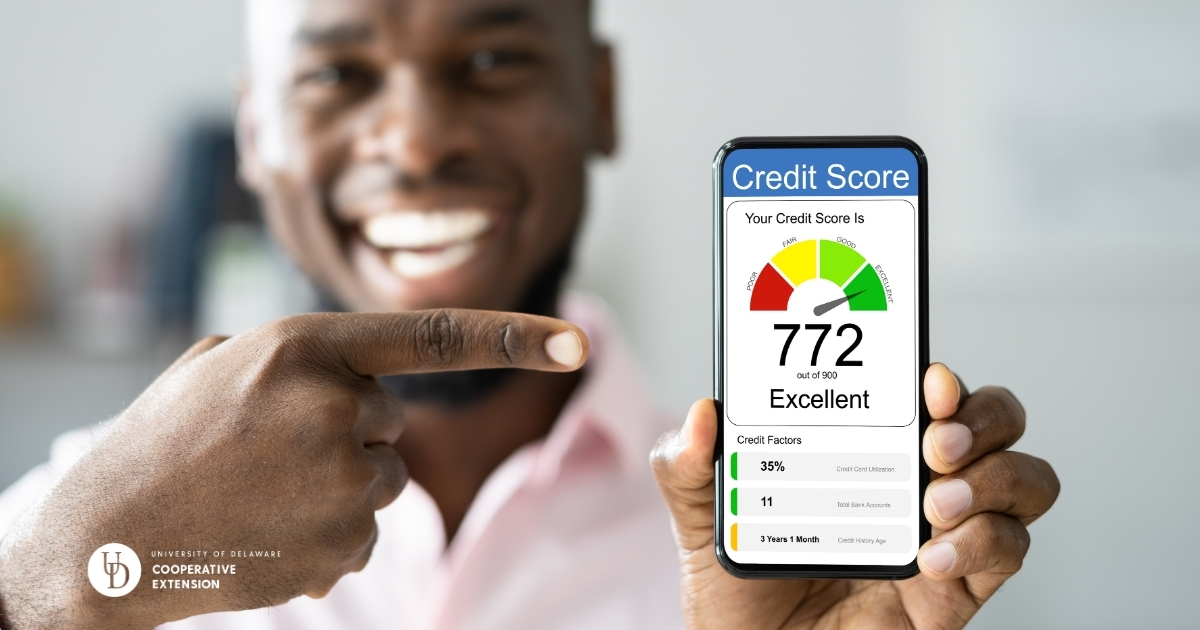 A man holding his credit score of 772 on his cell phone while smiling