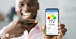 A man holding his credit score of 772 on his cell phone while smiling