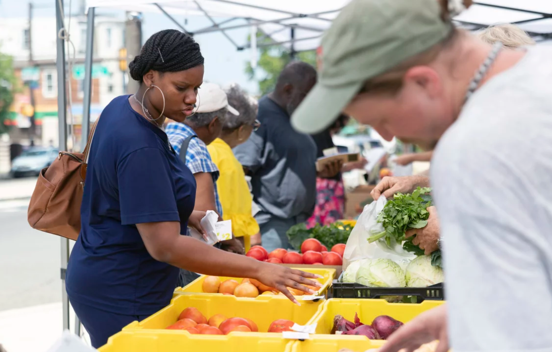 a woman shopping for vegetables