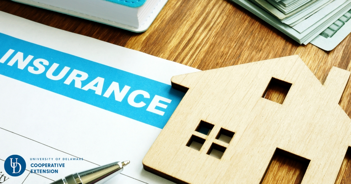 insurance form with a wooden model home piece on a table