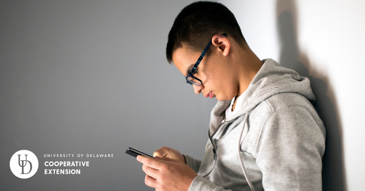 A teen on his phone