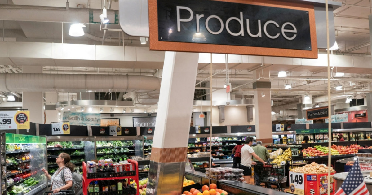 A grocery aisle of produce.