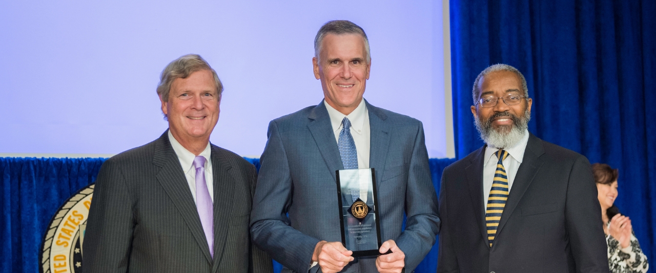 Roger Glendenning accepting an award.
