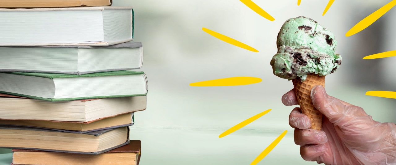 A stack of books with a person holding an ice cream cone