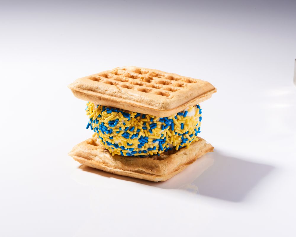 Ice cream sandwich with blue and gold sprinkles
