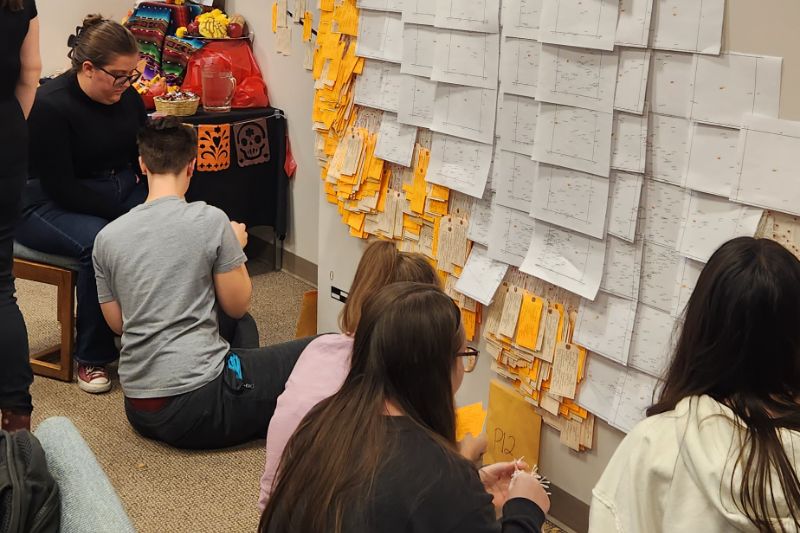 Anthropology students install the Hostile Terrain 94 project in the department conference room, an art and educational installation on immigration issues in the United States