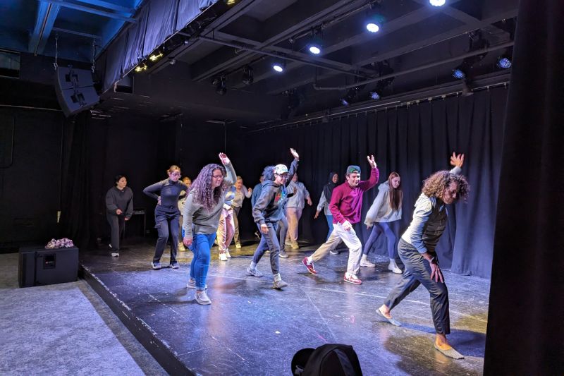 Anthropology students on stage dancing