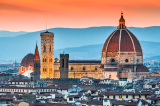 View at sunset of a medieval church with a large red dome in Florence, Italy.