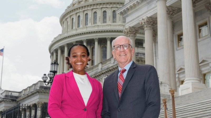 A college student and congressman in front of the U.S. Capitol Building, Washington, D.C.