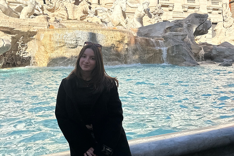  Sabrina Finegold sitting in front of a fountain in Florence, Italy