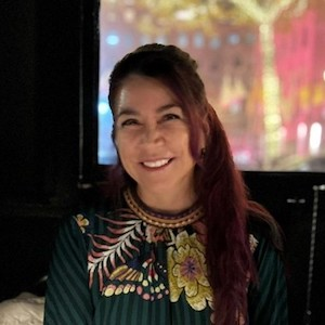 Headshot photo of Carla Guerron Montero