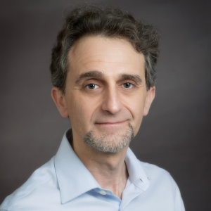 Headshot photo of Nigel Caplan