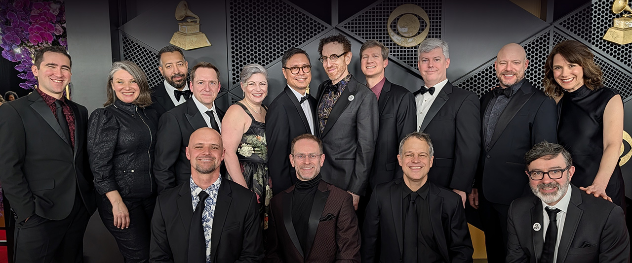 Group of Grammy winners posing including Miles Brown