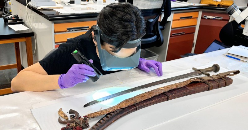 student observing artifact