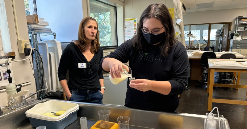 Student preparing a pulp paper with guest instructor