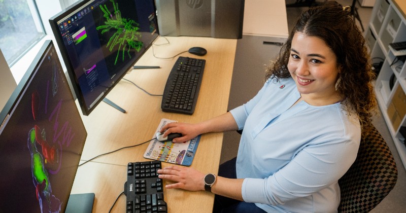 student works on biology research in the Ammon Pinizzotto Biopharmaceutical Innovation Center.