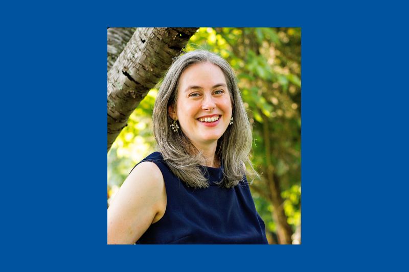 Jennifer Van Horn headshot atop a University of Delaware blue solid background