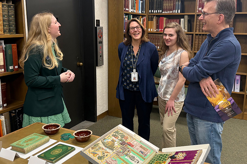 Ashley Vernon speaking with visitors about the Poison Book Project at the Winterthur Research Building 2026 Open House.