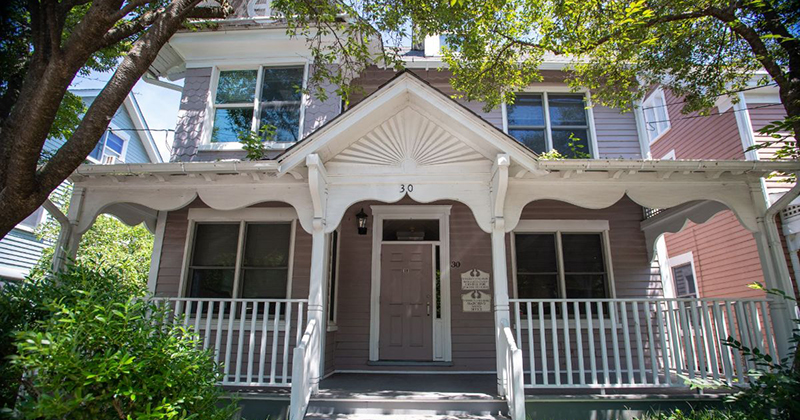 The front porch of a historic house on East Delaware Avenue at the University of Delaware
