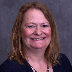 Headshot photo of Alexandra Coombs