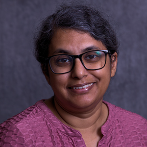 Headshot photo of Ginu Thomas