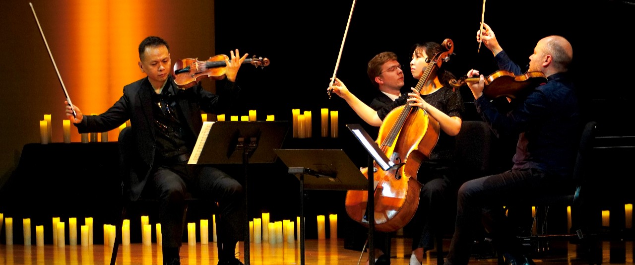 Violinists on stage performing