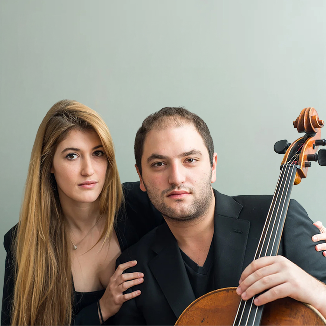 Publicity image of Marika Bournaki and Julian Schwarz, who is holding a cello.