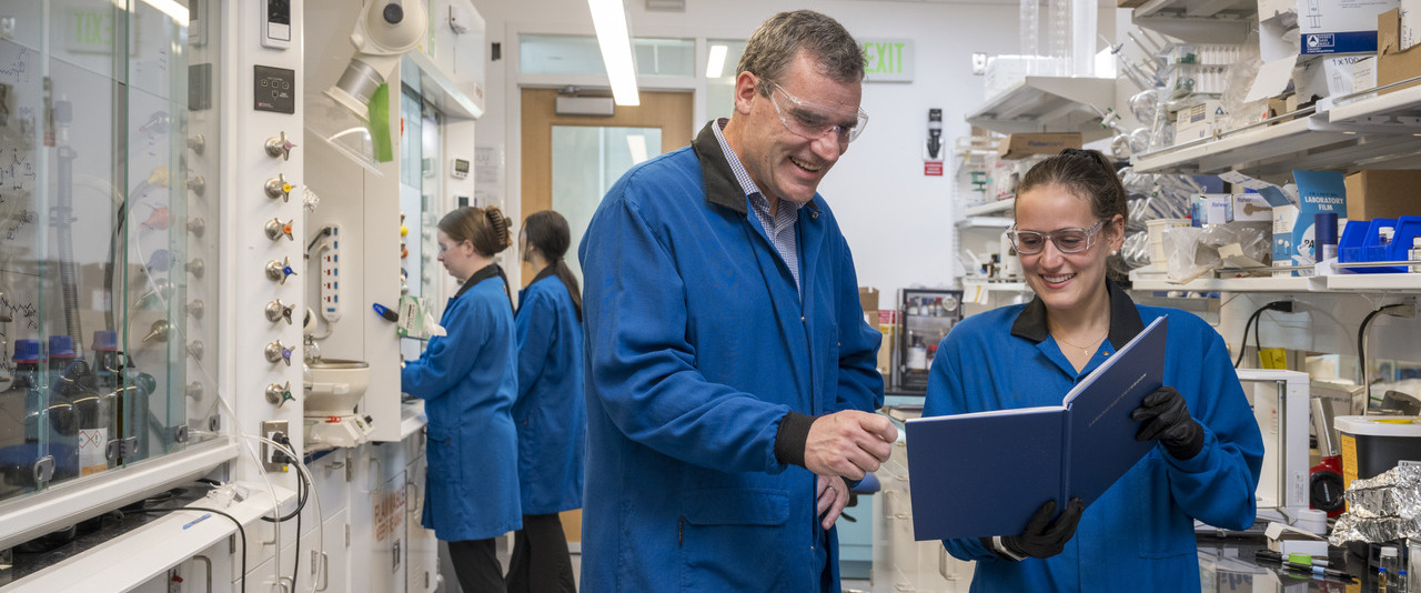 Joseph (Joe) Fox, Chemistry & Biochemistry & Materials Science professor with students in bio lab