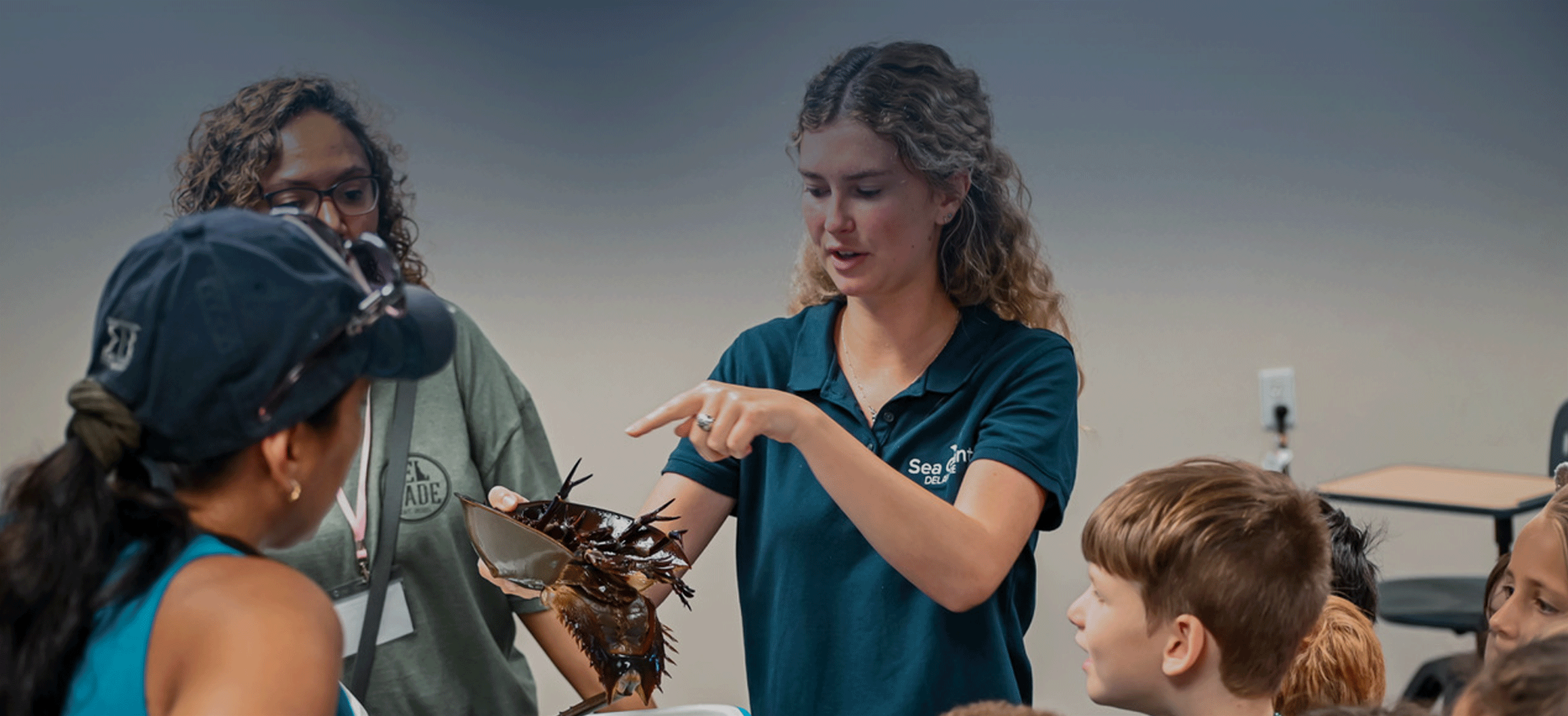 DESG intern Alexandra Dugan instructing students on the anatomy of a horseshoe crab