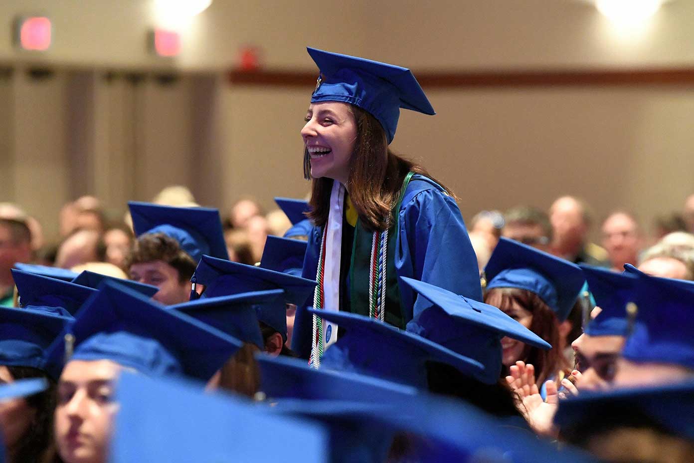  Graduate laughing at CEOE convocation