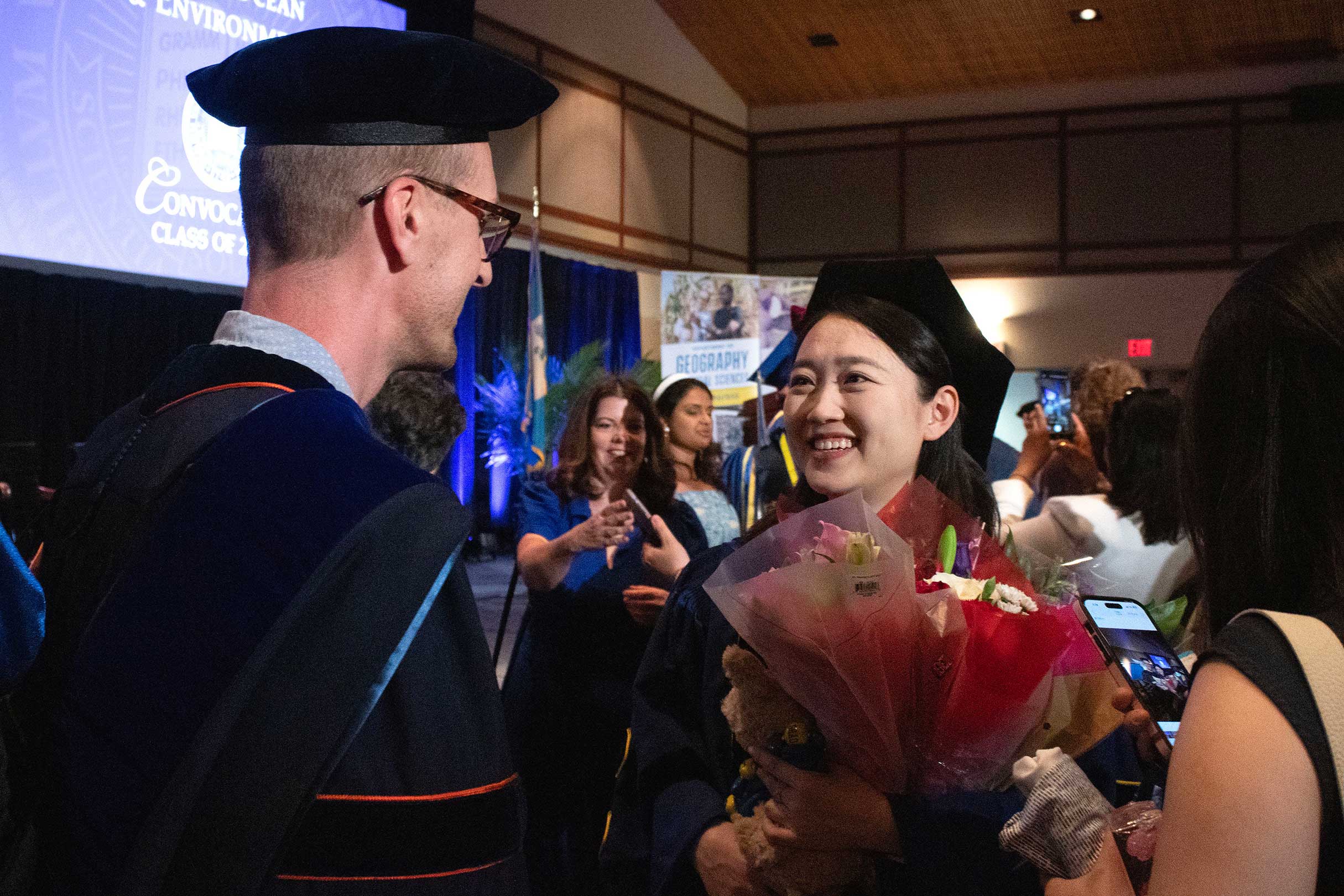  Recent graduate chatting with professor 