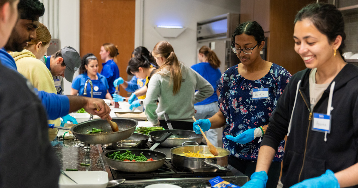 Students applying various cooking techniques in a Spice Kitchen class.