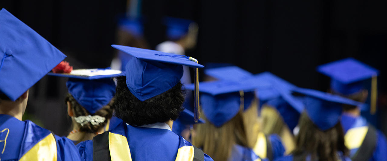 Students wearing graduation regalia at CHS Convocation