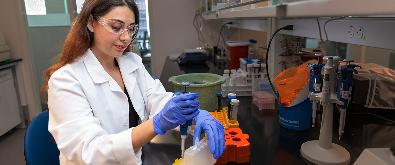 MMS Ph.D. student  conducting research in the AP Bio building on STAR Campus.