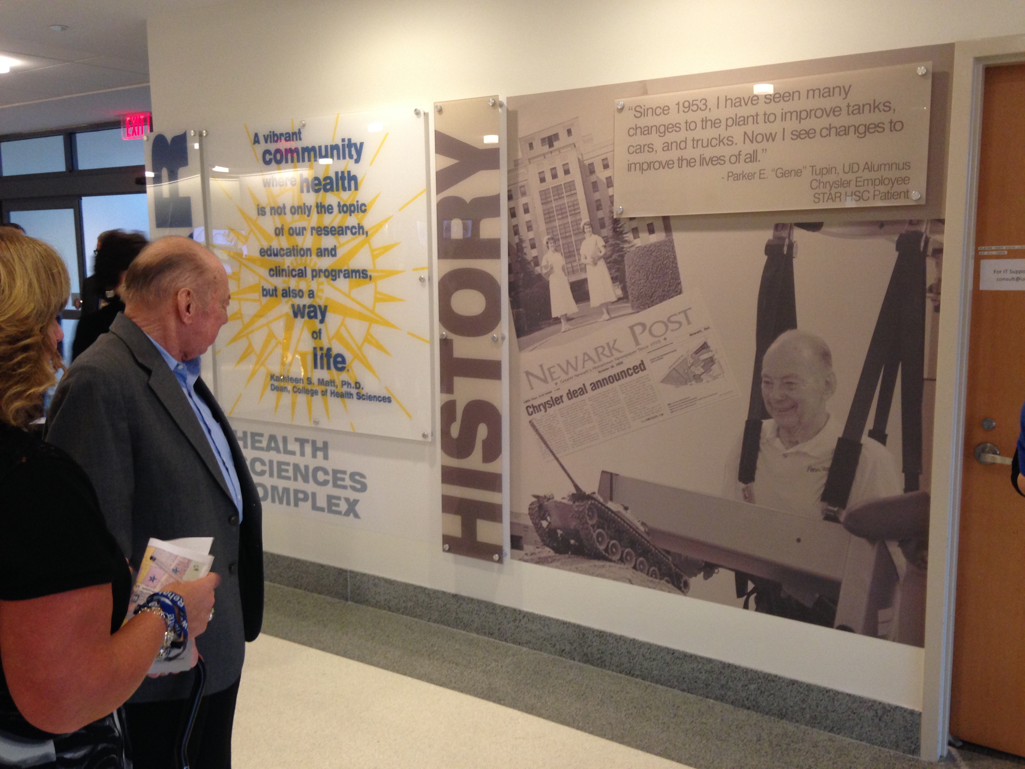 Gene Tupin looking at history wall in STAR tower