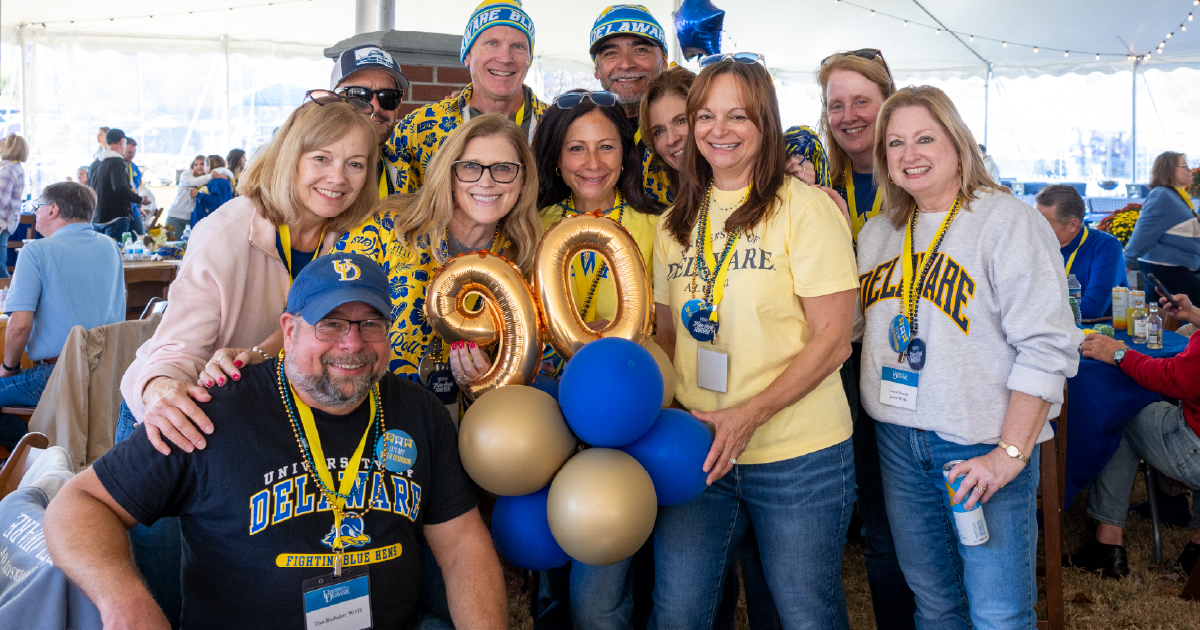 Alumni from the Class of 1990 celebrating at Homecoming. 
