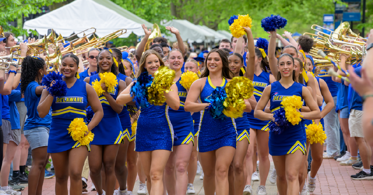 Blue Hen cheerleaders in the procession.
