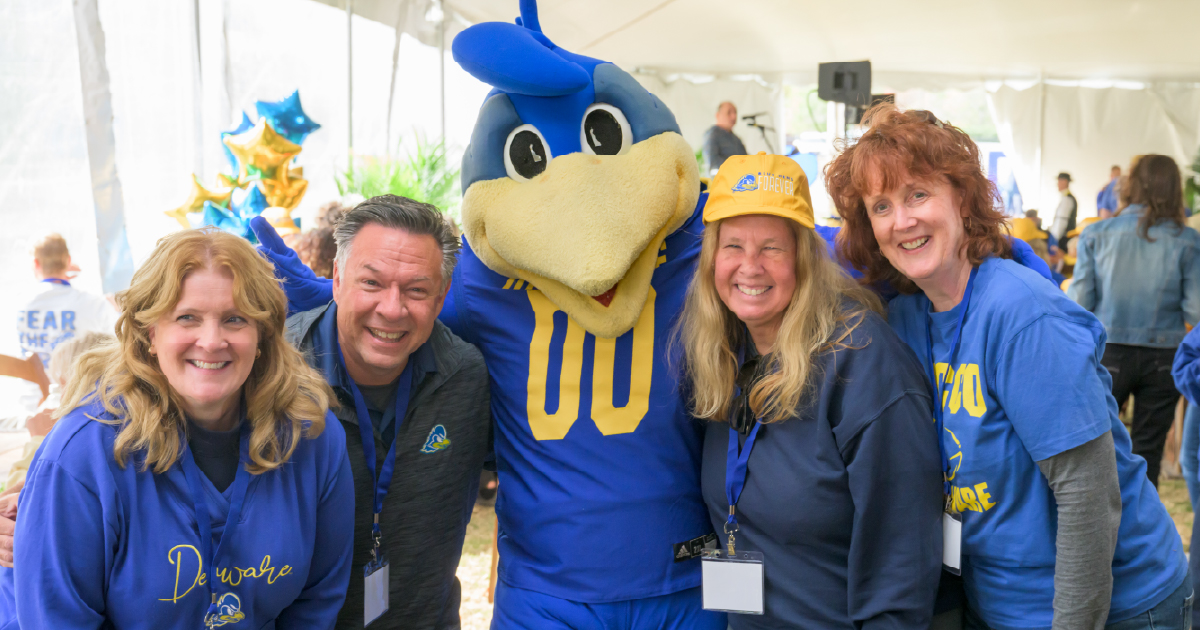 A group of Blue Hens at a tailgate event.
