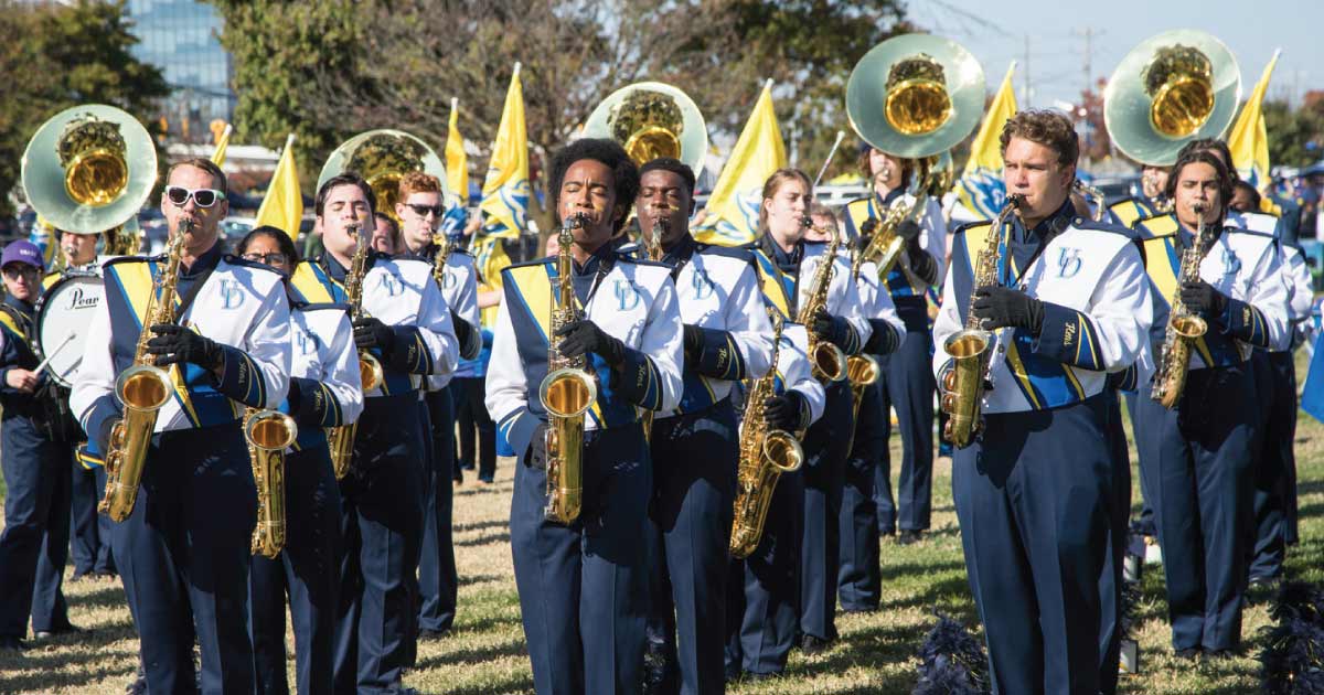 Musical siblings help UD Marching Band play on Alumni & Friends