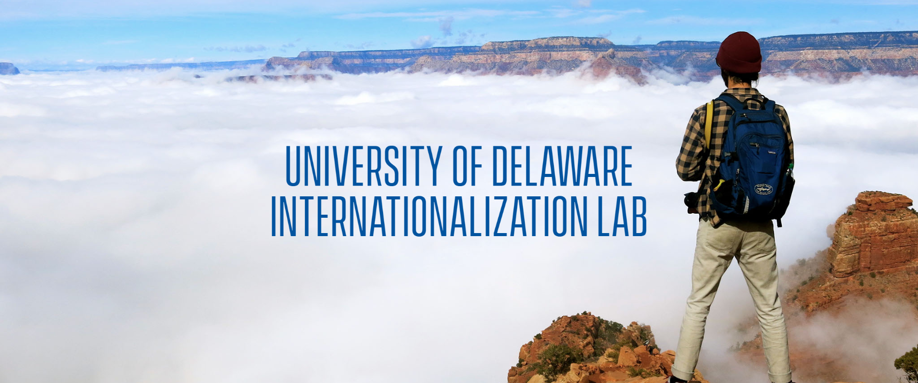 Internationalization Lab photo of student looking out over a view from a cliff
