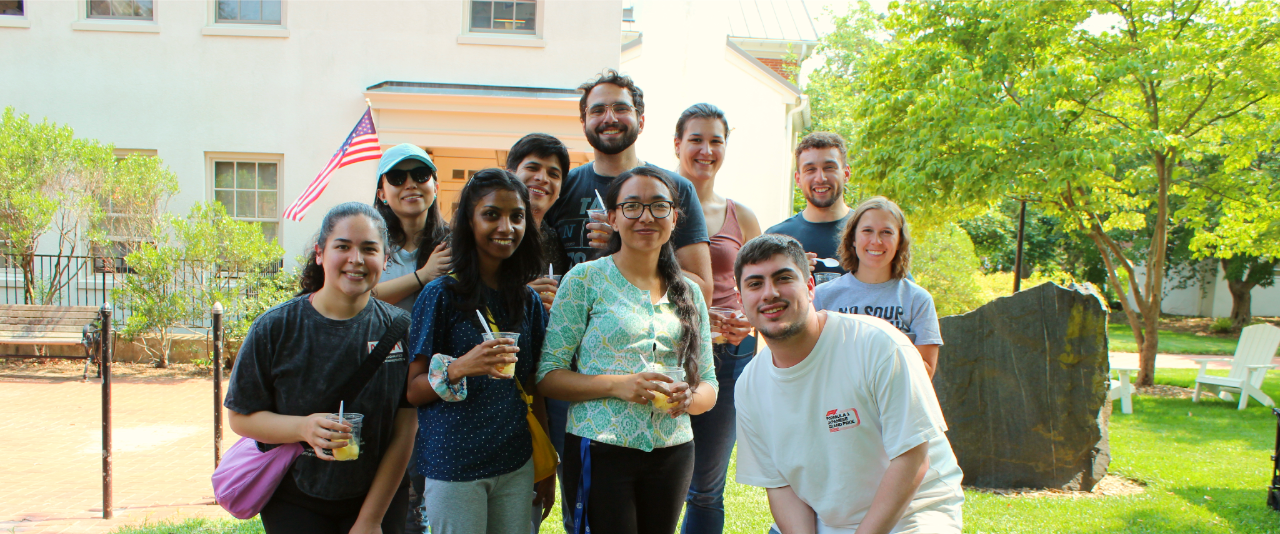International students, scholars, and family join staff at the summer social