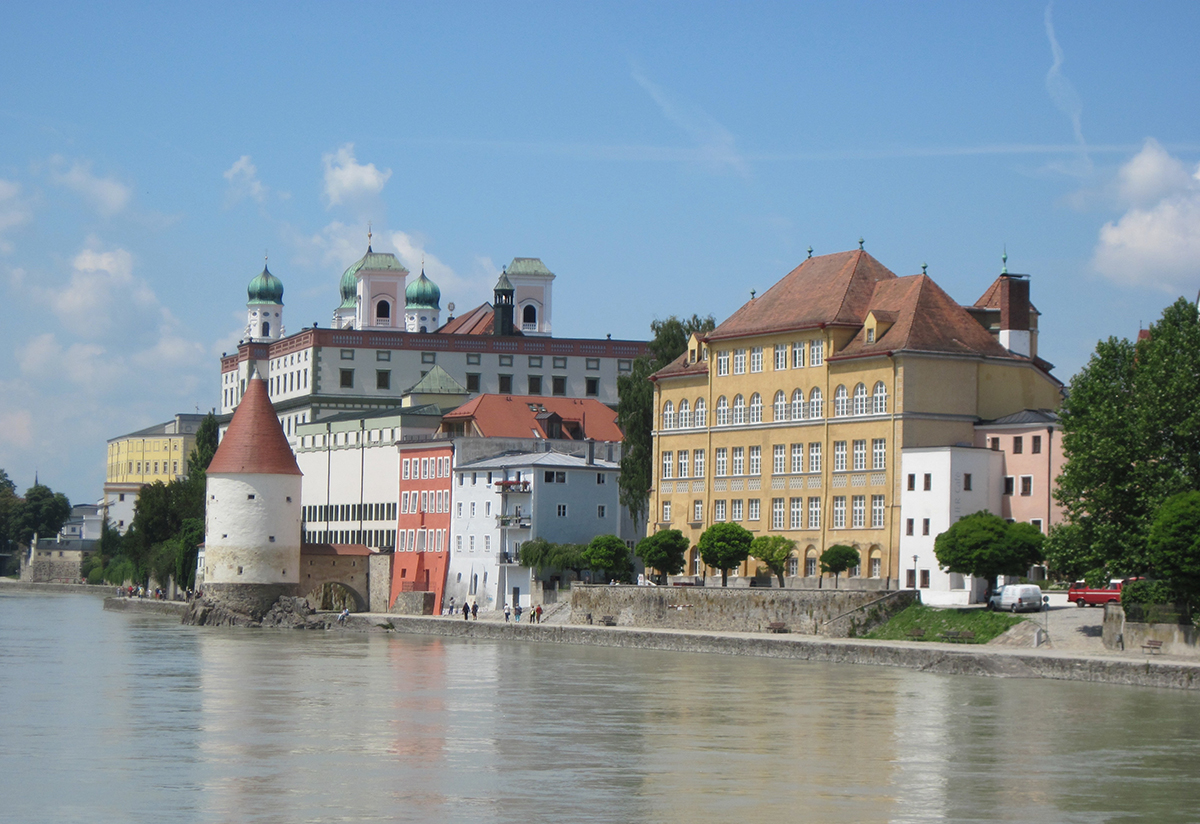 Photograph of buildings and a river in Passau
