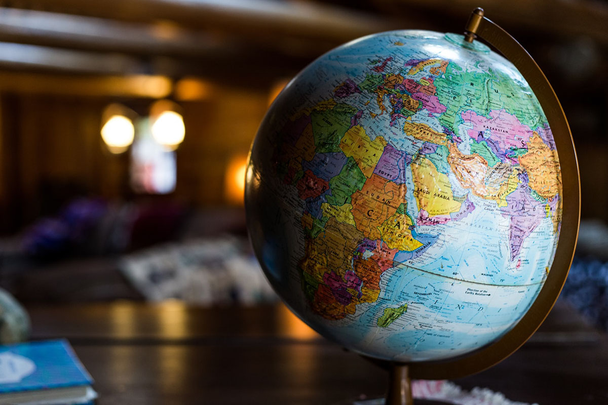 A globe model of Earth positioned on a school desk