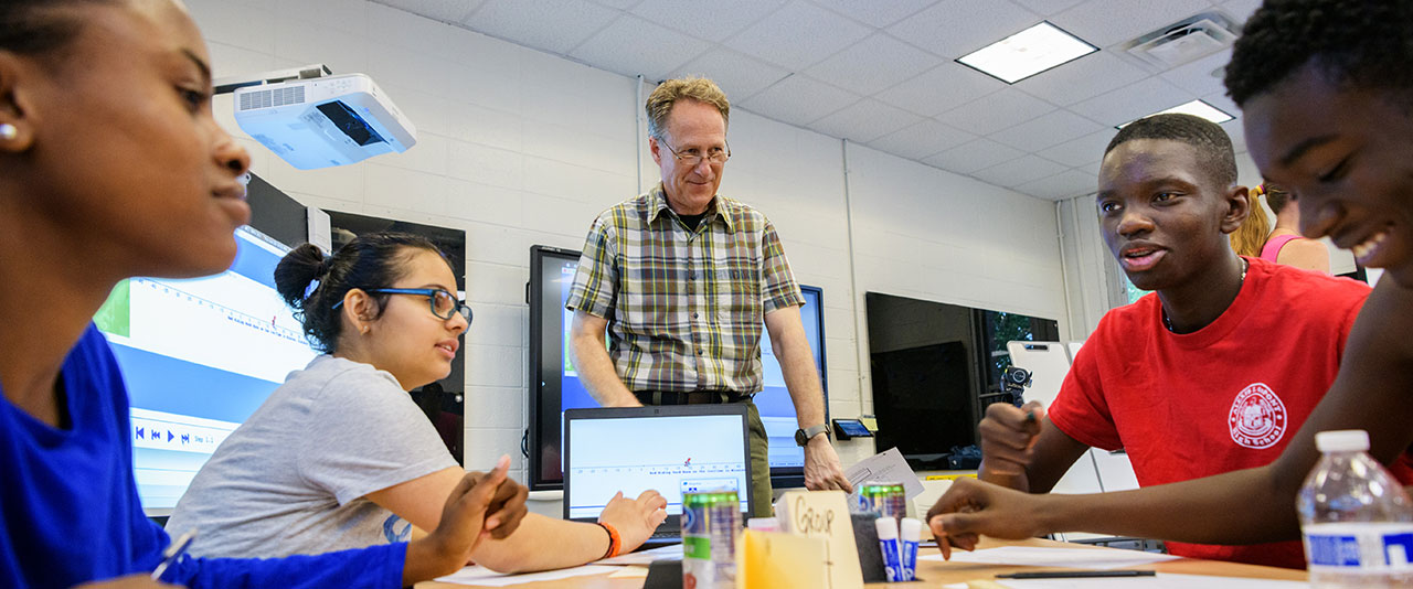 Associate Professor Charles Hohensee and students